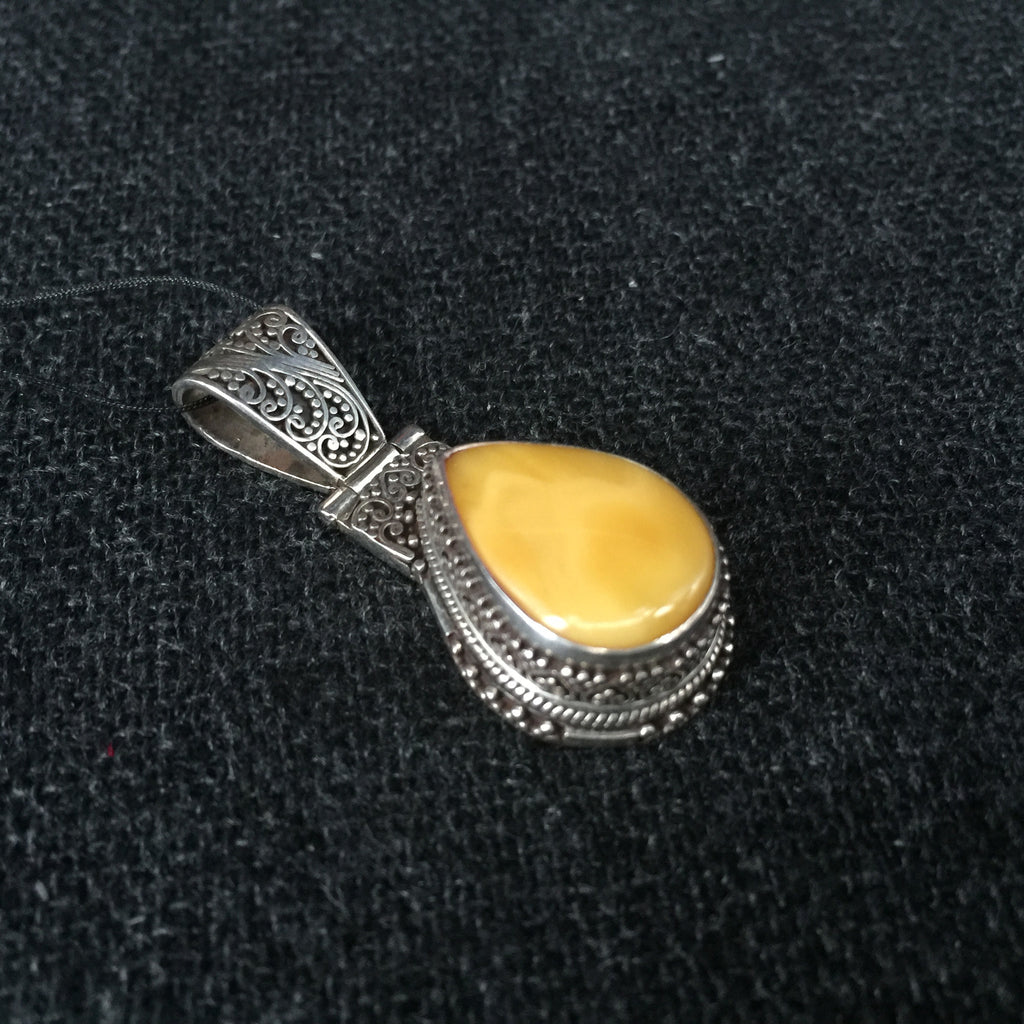 Tibetan Amber Teardrop Pendant Jewelry at Mahakala Fine Arts