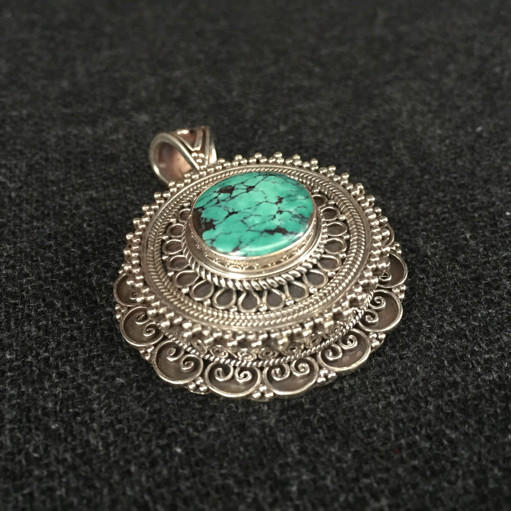 Detailed Handmade Himalayan Turquoise and Silver Pendant Jewelry at Mahakala Fine Arts