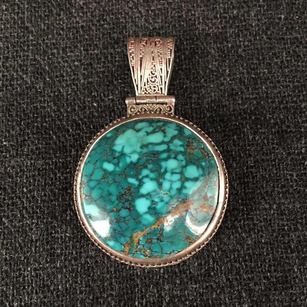 Handmade Himalayan Round Turquoise and Silver Pendant Jewelry at Mahakala Fine Arts